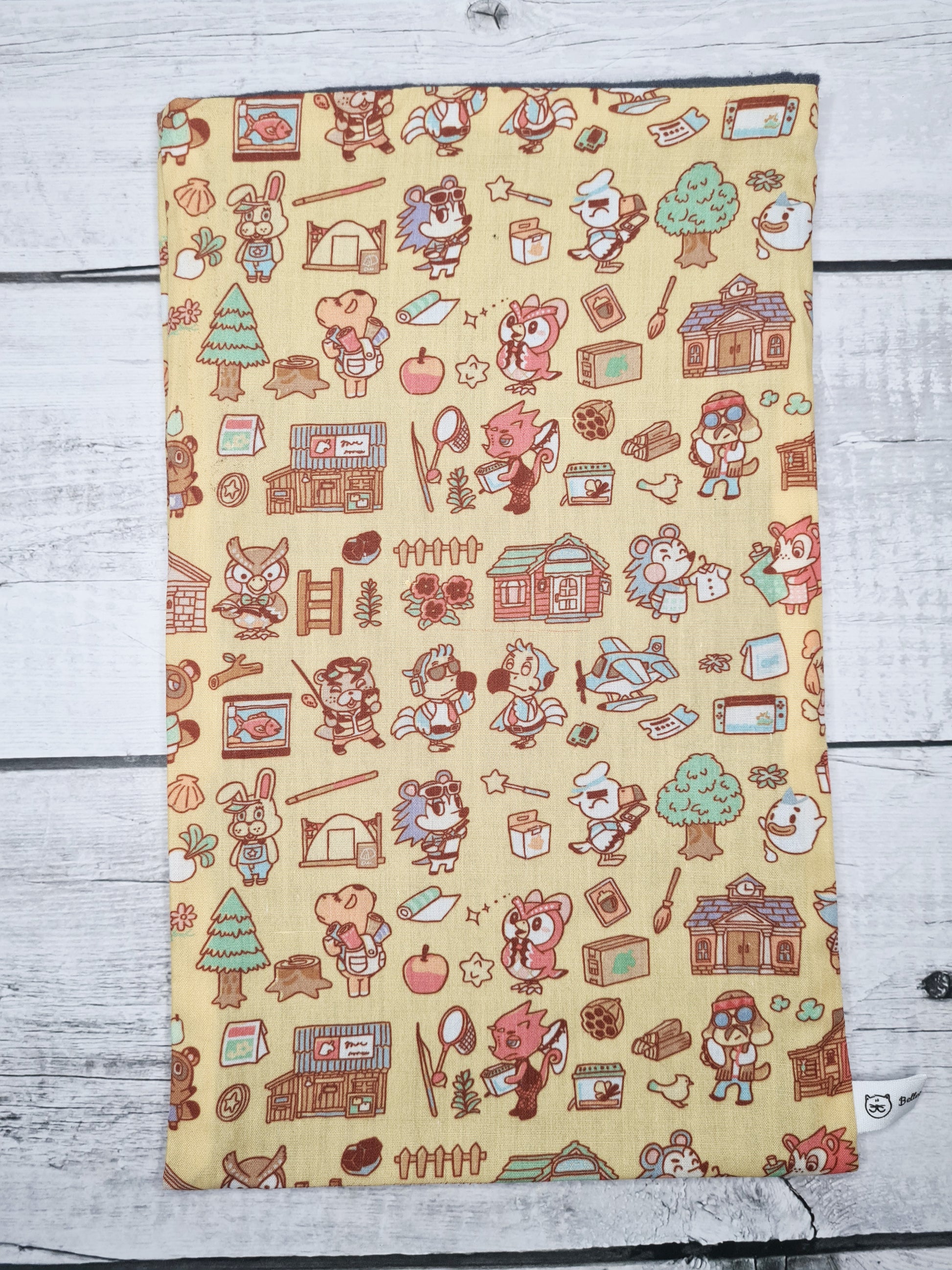 pochetet a livre animal crossing jaune de la marque bellette workshop